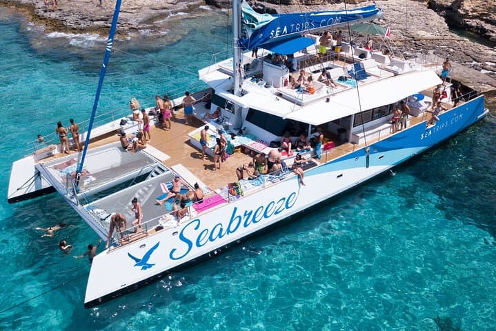 Blue Lagoon Evening Catamaran Cruise: Sunset Sailing to Comino's Turquoise Bays photo 2