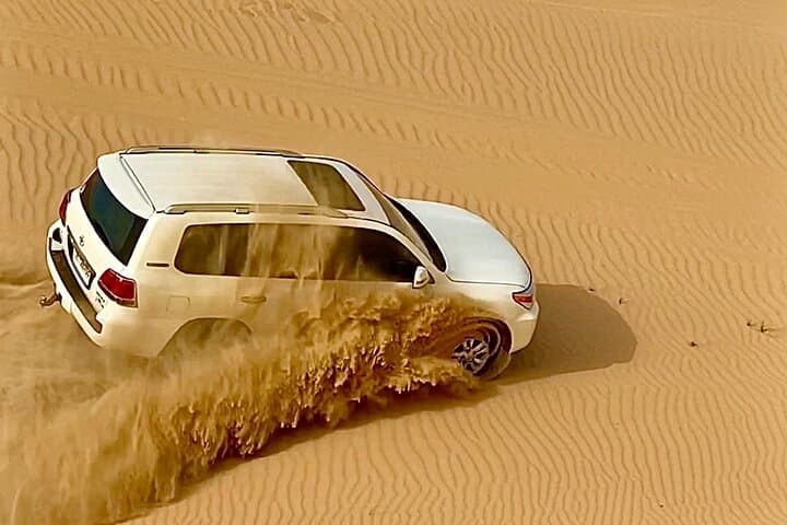 Sunrise Desert Safari from Abu Dhabi: Dune Bashing, Camel Farm & Sandboarding photo 6
