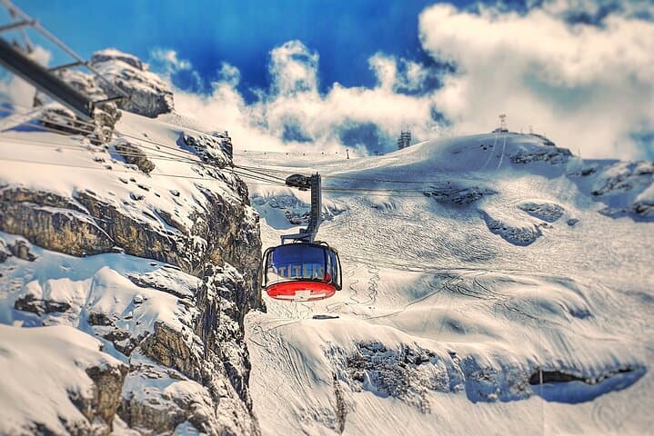 Mount Titlis Glacier World: Private Day Trip from Basel to Snow and Suspension Bridges