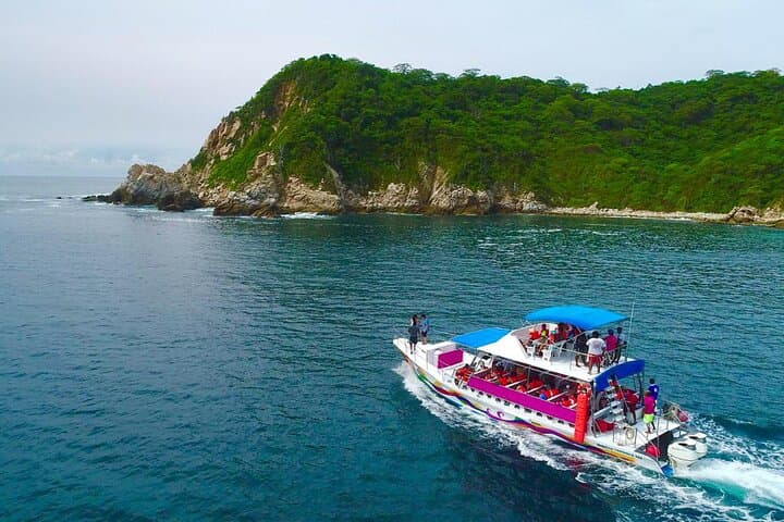 Explore Seven Bays: Full-Day Huatulco Boat Tour with Snorkeling and Seafood photo 3
