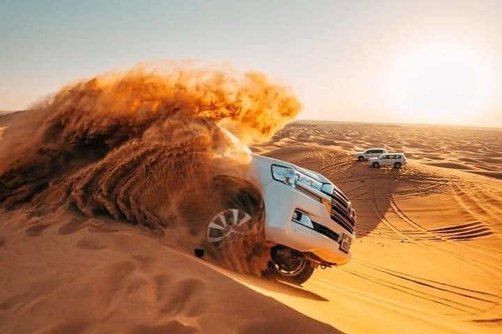 Morning Desert Safari in Dubai: Dune Bashing, Camel Rides & Sandboarding