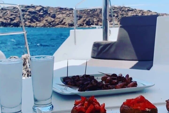 Private Mykonos Yacht Tour: Kalafatis to Rhenia with Swimming, SUP & Lobster Lunch photo 2