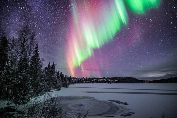 Ice Floating on a Forest Lake Under the Aurora Borealis in Rovaniemi photo 2