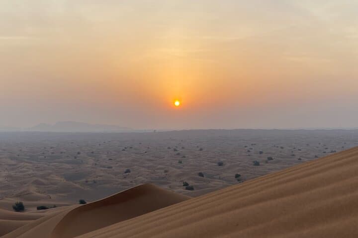 Sunrise Desert Safari with Dune Bashing, Quad Biking & Camel Ride in Dubai