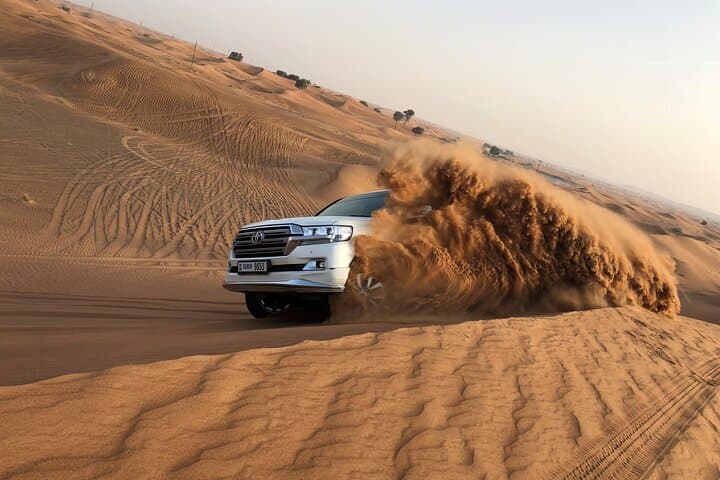 Private Evening Desert Safari Dubai: Dune Bashing, Camel Rides & Sunset BBQ