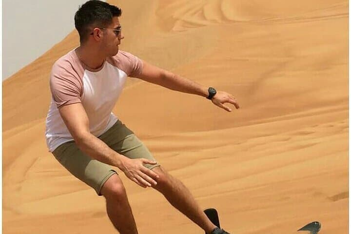Dubai Desert Safari: Dune Bashing, Sandboarding & Camel Ride with BBQ Dinner photo 3