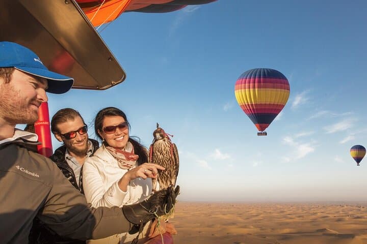 Sunrise Hot Air Balloon Over Dubai Desert with Falcon Show