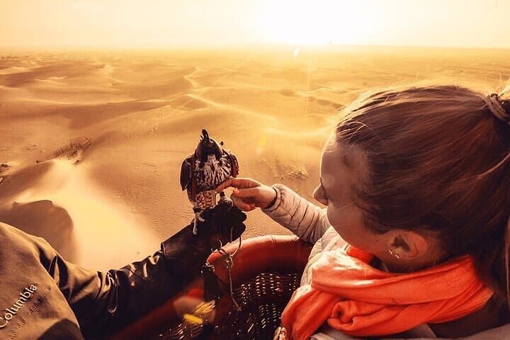 Sunrise Balloon Over Dubai Desert: Falcon Show & Camel Ride photo 2