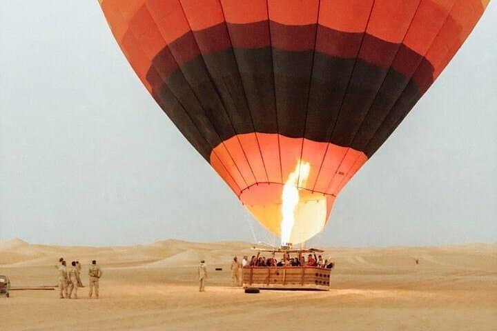 Sunrise Balloon Over Dubai Desert: Falcon Show & Camel Ride