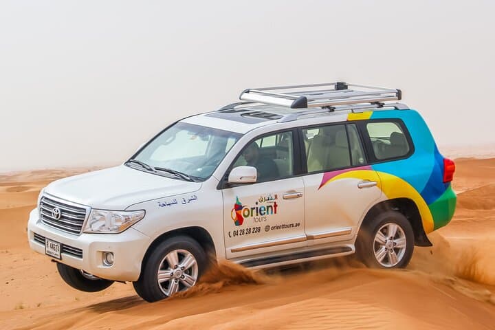 Sunset Dunes: Private Dubai Desert Safari with BBQ, Sandboarding & Camel Ride photo 4