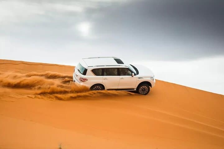 Dubai Evening Desert Safari: Quad Bike, Camel Ride & Sunset BBQ
