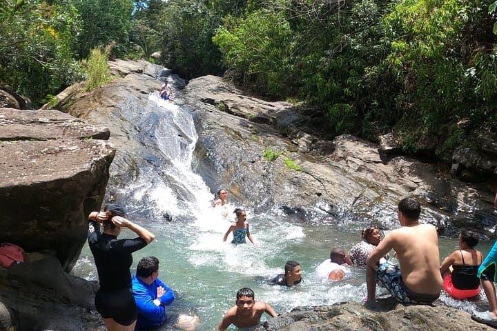 El Yunque Waterslide & Waterfall Tour from San Juan — Natural Rock Slides and Local Food
