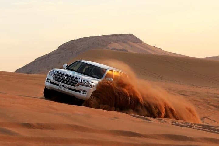 Morning Dubai Desert Safari: Dune Bashing, Camel Ride & Sandboarding