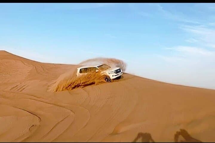 Dubai Red Dunes Desert Safari: Sunset BBQ, Camel Ride & Sand-Boarding Experience