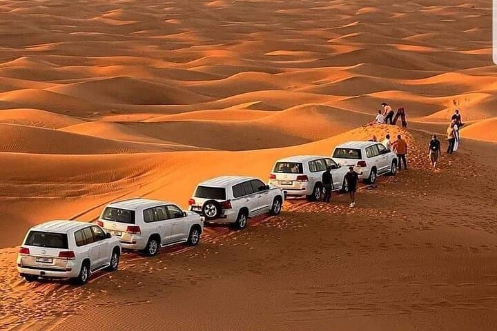 Dubai Red Dunes Desert Safari: Sunset BBQ, Camel Ride & Sand-Boarding Experience photo 2