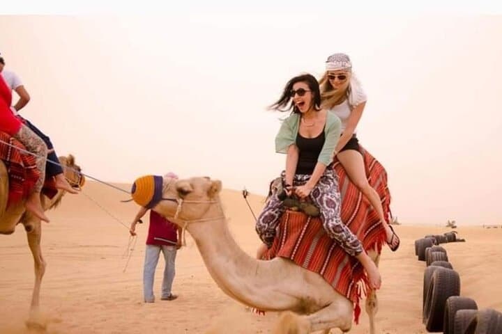 Dubai Red Dunes Desert Safari: Sunset BBQ, Camel Ride & Sand-Boarding Experience photo 3
