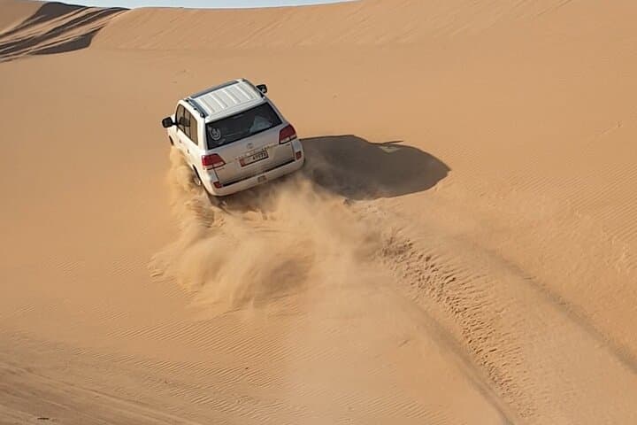 Sunset-to-Starlight Abu Dhabi Desert Safari: Dune Bashing, Quad Biking & Camp Experience photo 4