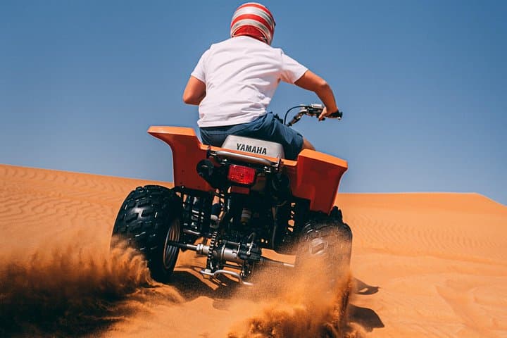 Red Dunes Quad Bike Safari Dubai — Sandboarding, Camel Ride & Sunset BBQ Experience photo 2