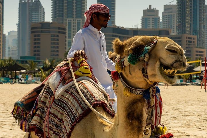 Red Dunes Quad Bike Safari Dubai — Sandboarding, Camel Ride & Sunset BBQ Experience photo 3