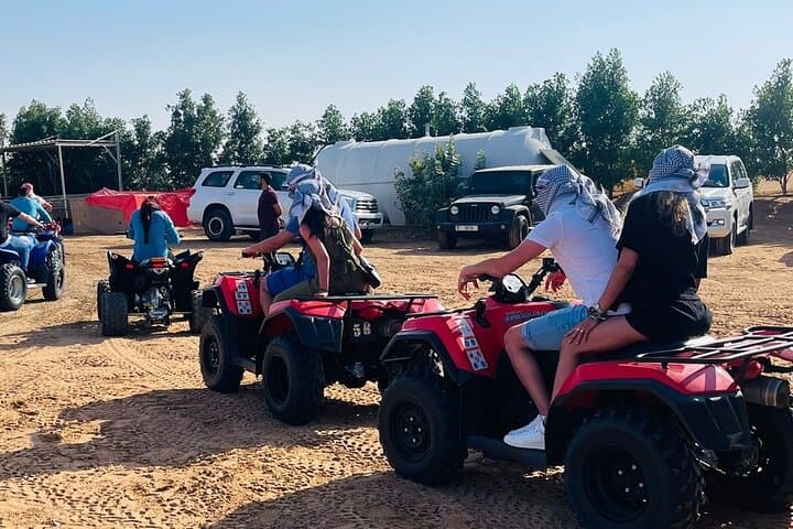 Dubai Evening Desert Safari: Quad Bike ATV, Camel Ride & BBQ Experience photo 4