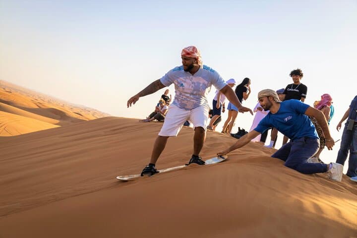 Dubai Red Dunes Safari: Sandboarding, Camel Ride, Falcon Experience & VIP Desert Camp photo 3