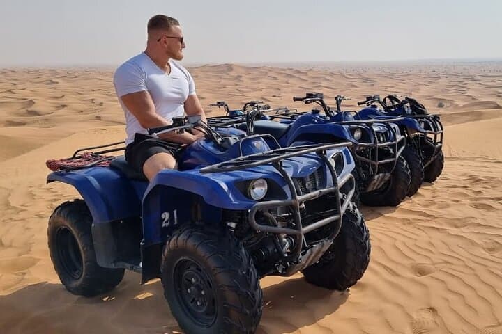 Dubai Red Dunes Self-Drive Quadbike with Camel and Falcon Experience photo 5