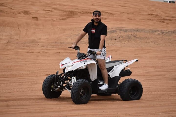 Dubai Evening Desert Safari: Quad Bike ATV, Camel Ride & BBQ Experience photo 5