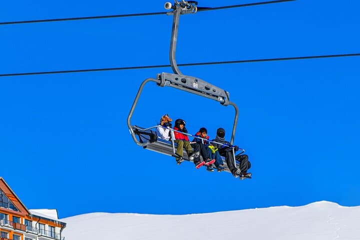 Gudauri Adventures: One-Day Ski, Paraglide & Snowmobile Tour from Tbilisi