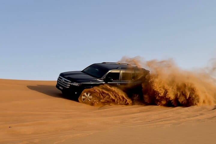 Dubai Desert Safari with BBQ & Sandboarding: Dune Bash, Camel Ride, Night Camp