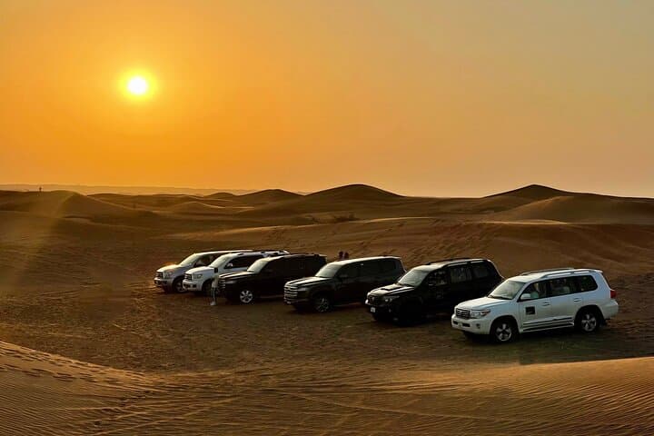 Dubai Desert Safari with BBQ & Sandboarding: Dune Bash, Camel Ride, Night Camp photo 2