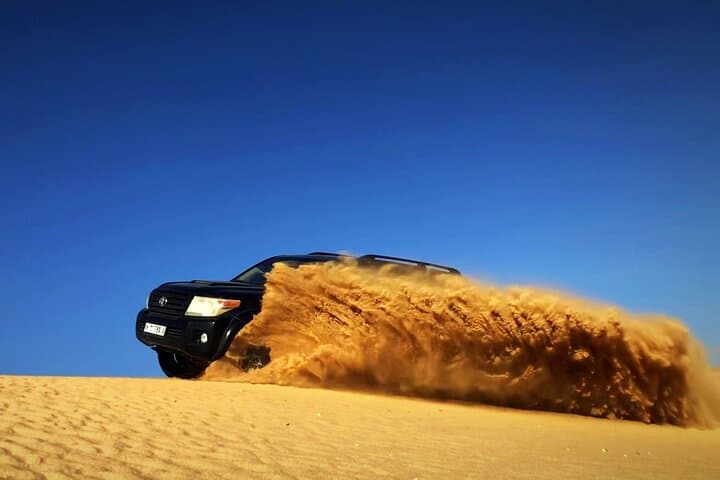 Dubai Desert Safari with BBQ & Sandboarding: Dune Bash, Camel Ride, Night Camp photo 3