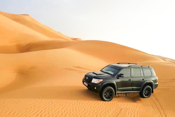 Dubai Desert Safari with BBQ & Sandboarding: Dune Bash, Camel Ride, Night Camp photo 4