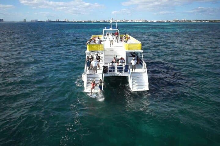 Half-Day Catamaran Sailing to Isla Mujeres: Snorkel, Beach Club & Sunset from Cancun
