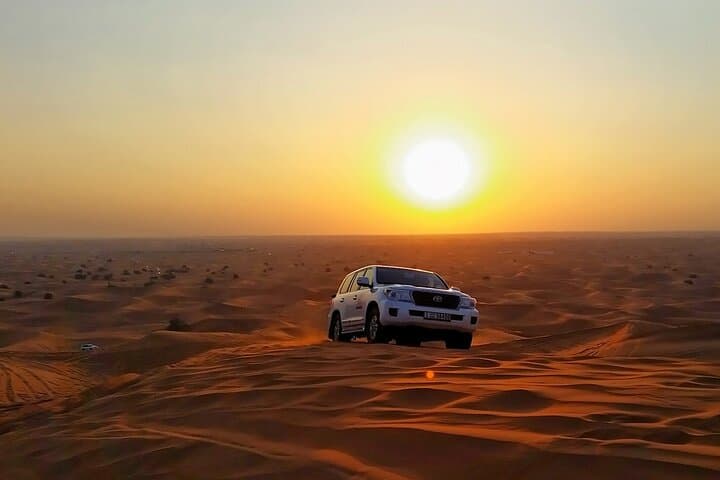 Sunset Dunes: Dubai Desert Safari with Dune Bashing, Camel Ride & BBQ photo 2