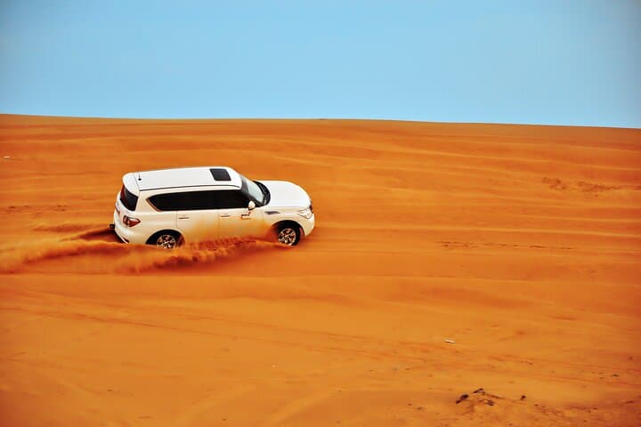 Sunset Dunes: Dubai Desert Safari with Dune Bashing, Camel Ride & BBQ photo 3