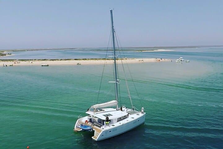 Private Half-Day Catamaran Tour in Ria Formosa — Swim, Snorkel & Paddle photo 3