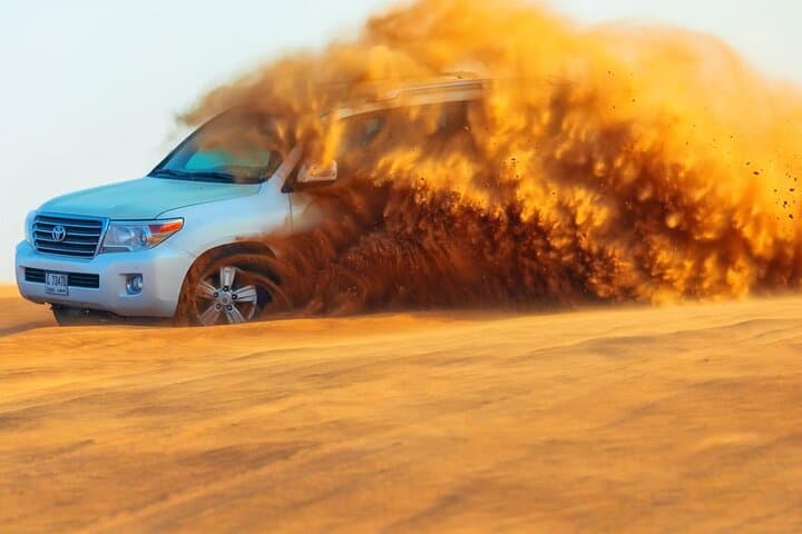 Morning Dubai Desert Safari — Dune Bashing, Sandboarding & Camel Ride photo 4