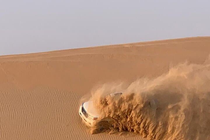 Dubai Evening Desert Safari: Private Red-Dune Experience with Dinner & Entertainment photo 3