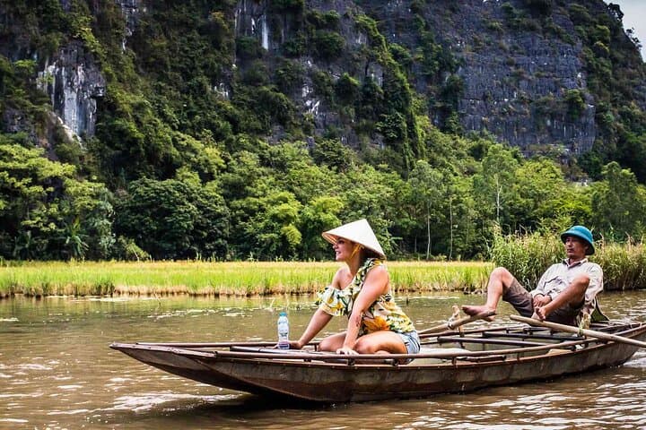 Day Trip to Trang An, Hoa Lu & Mua Cave from Hanoi — Boat Caves and Summit Views photo 3