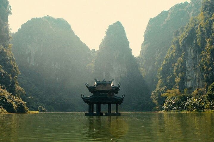 Hoa Lu & Mua Cave Full-Day Adventure: Bike, Boat & Trang An Scenic Cruise photo 3