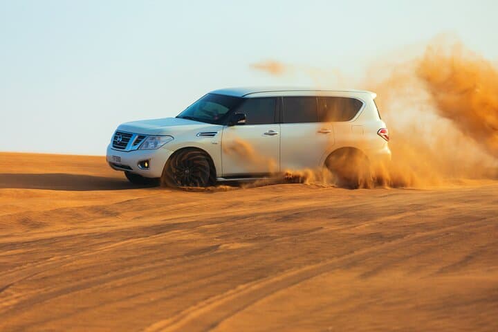 Dubai Evening Desert Safari with BBQ Dinner: Red Dune Adventure & Bedouin Camp Experience