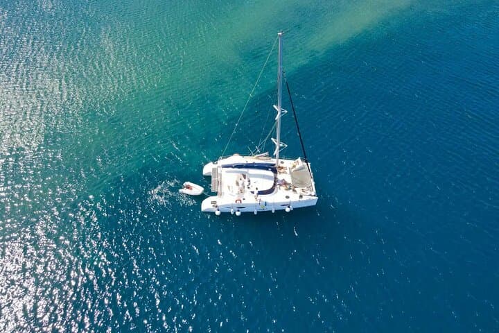 Santorini Private Half-Day Catamaran Cruise — Red Beach, Hot Springs & Caldera Views photo 3