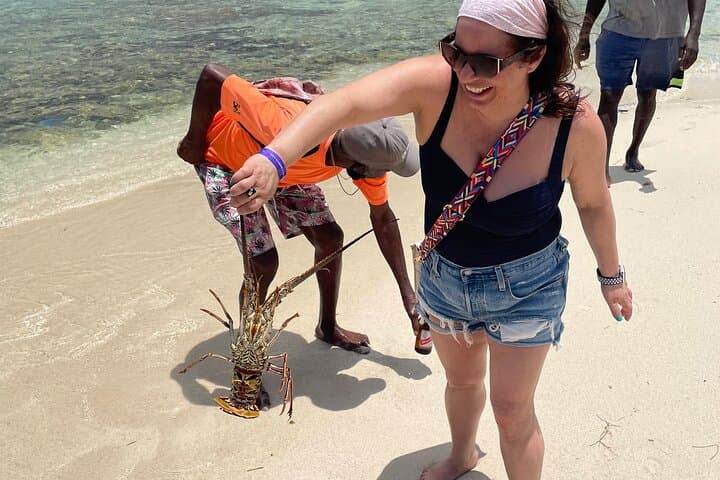 Negril Glass-Bottom Boat Tour & Snorkeling to Booby Cay, Seven Mile Beach and Rick's Cafe photo 1