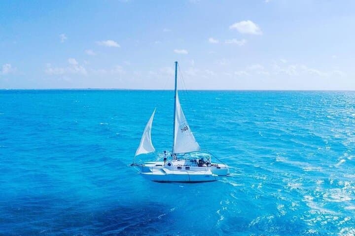 Private Catamaran to Isla Mujeres: Snorkel Reefs, Beach Club Lunch & Open Bar from Cancun