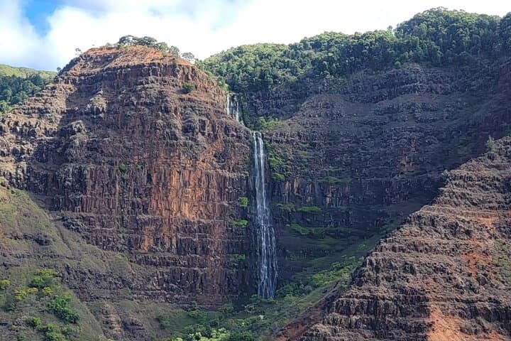 Experience Kauai’s Untamed Beauty with a Doors-Off Hughes 500 Helicopter Flight photo 4