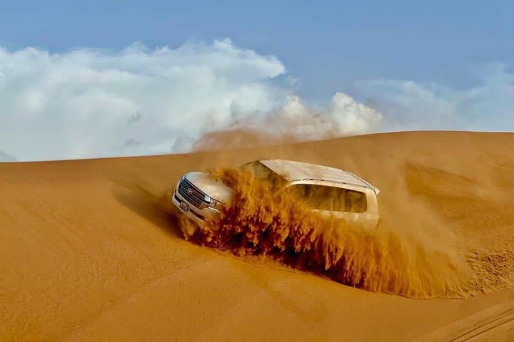 Dubai Desert Safari: Dune Bashing, Camel Ride & Sunset BBQ Experience