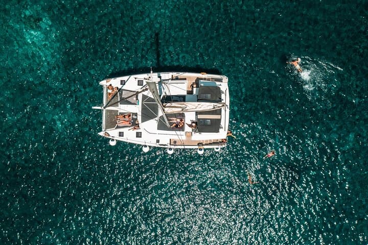 Santorini Caldera Catamaran Cruise to Hot Springs, Red & White Beaches photo 1