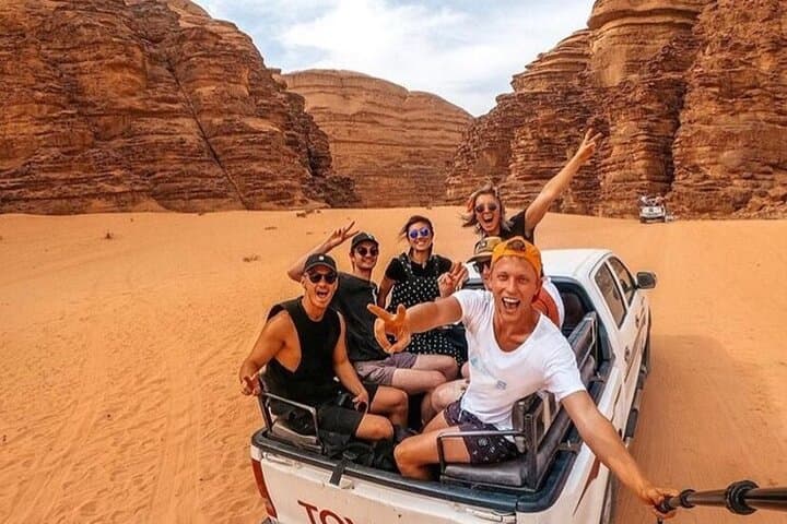 Wadi Rum Full-Day Jeep Tour with Bedouin Overnight — Sandboarding, Burdah Bridge & Sunset