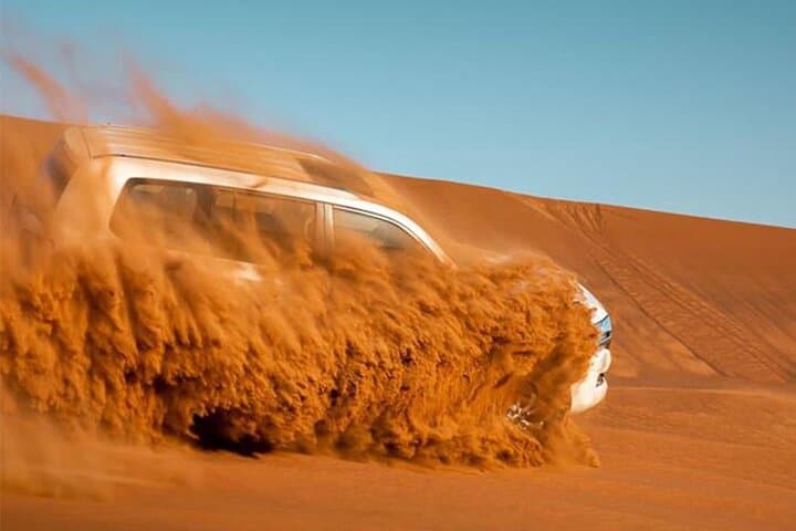 Dubai Red Dune Safari: Sunset Dune Bashing, Camel Ride & BBQ Camp