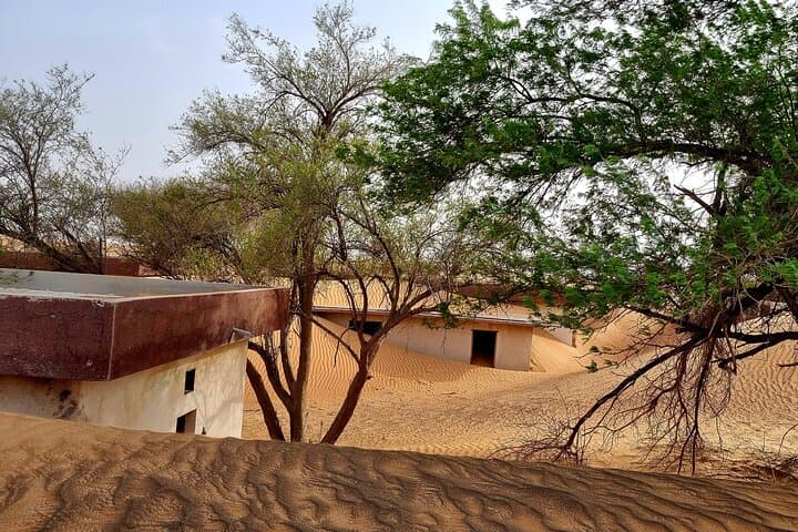 Private Al Madam Ghost Village Desert Safari with Dune Bashing & Sandboarding